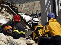 Italian rescuers pull woman from quake rubble