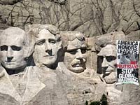 Activists arrested for banner on Mt. Rushmore