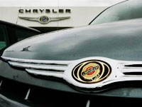 Chrysler closes deal, gives up control