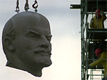 The huge granite head of Berlin's Lenin statue is hanging at a crane during its dismantling in Berlin November 13, 1991. After four days of preparation the 63 feet tall statue comes down. (AP)