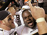 Missouri football players celebrate after defeating Kansas. (AP Photo/Charlie Riedel)